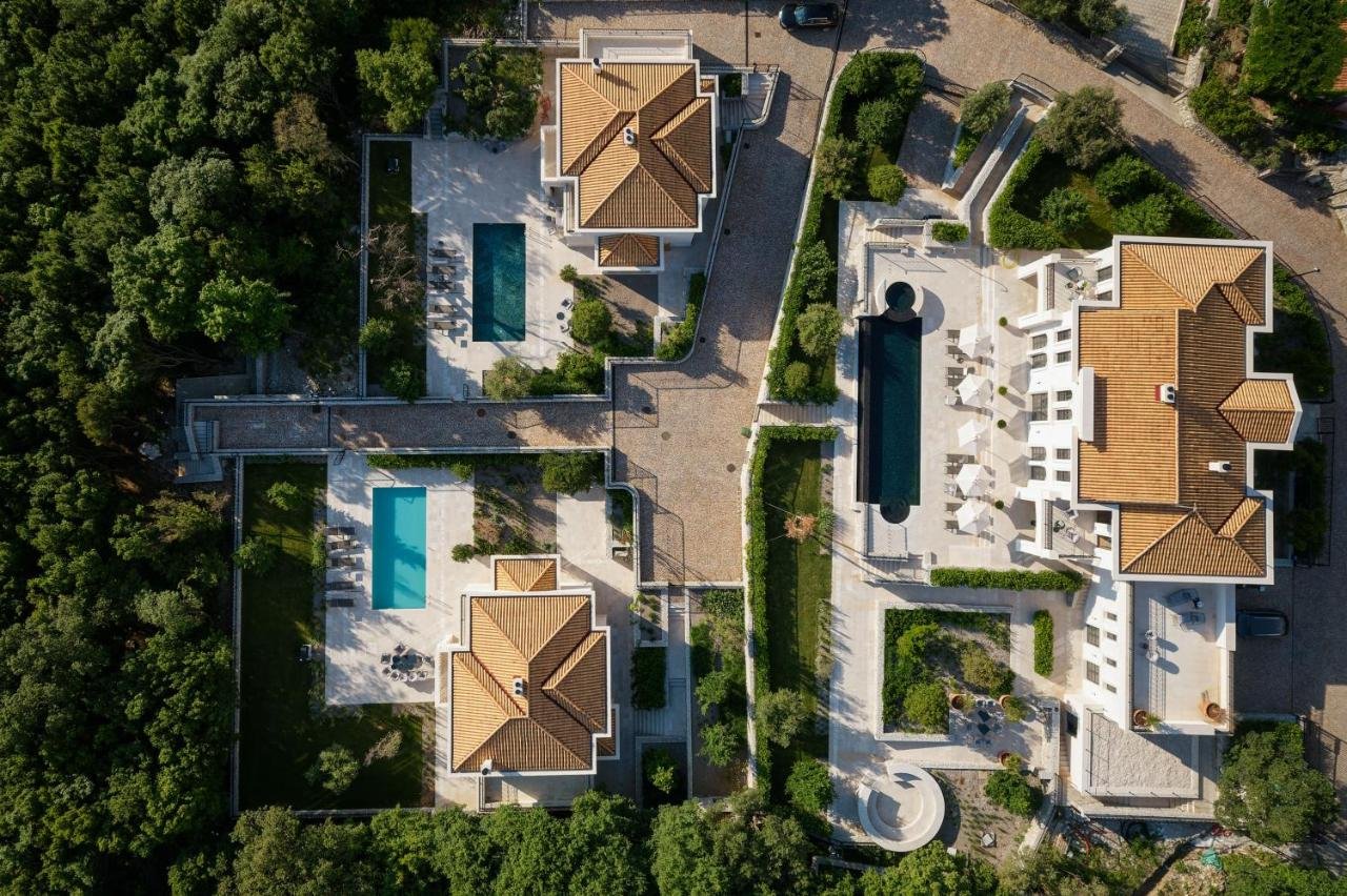 Budva: ‍

This magnificent estate consists of 3 villas and hosts 26 persons. Each villa has its own terrace and a pool, a hot tub, a sauna and a gym. The bea 