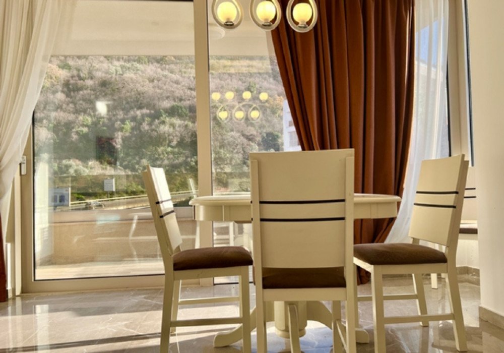 Budva Riviera, Rafailovichi district. One bedroom apartment in a new house.Distance to the sea 200m.Open poolArea 63 sq.m.Floor - sixthThe house is...