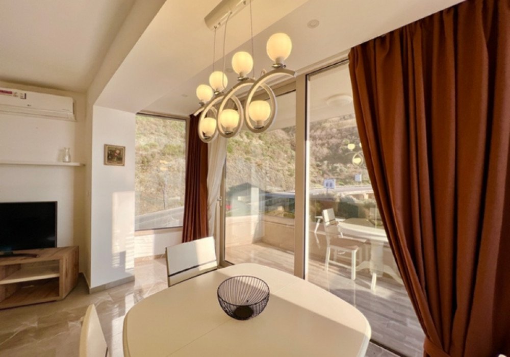 Budva Riviera, Rafailovichi district. One bedroom apartment in a new house.Distance to the sea 200m.Open poolArea 63 sq.m.Floor - sixthThe house is...